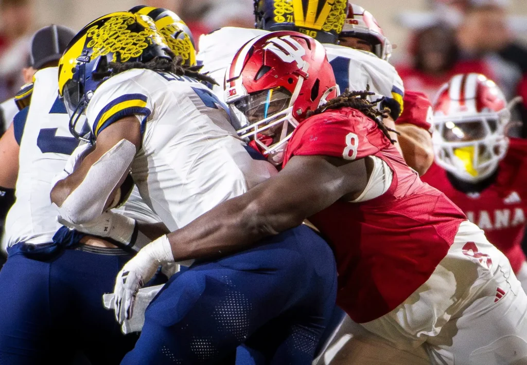 CJ West, defensive tackle from Indiana, showcasing strength on the field.