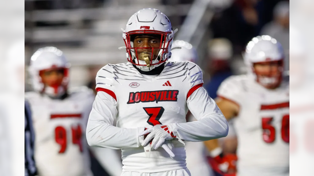 Quincy Riley, cornerback from Louisville, making a crucial tackle.